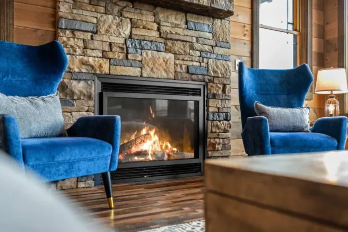 Settle in by the fire — the heart of the living room and the perfect place to unwind.