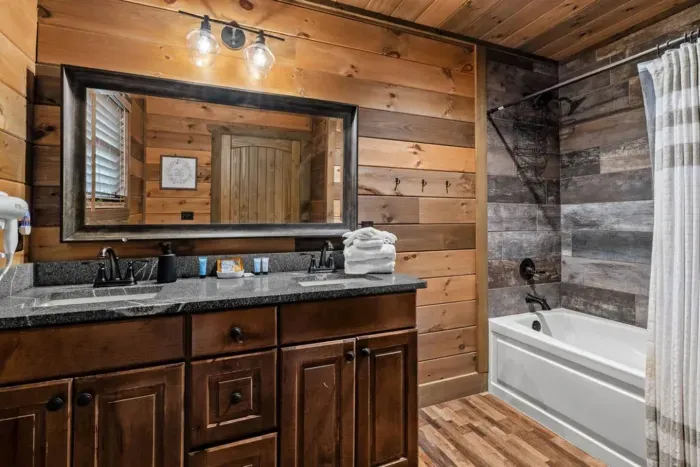 This private ensuite bathroom offers a tub and shower combo, double sinks, and comes stocked with starter essentials like shampoo, conditioner, body wash, and more—everything you need for a comfortable stay.