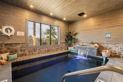 The indoor pool is 4 feet deep—perfect for a refreshing dip or laid-back swim. It features a calming waterfall for added ambiance and is equipped with a pool alarm for extra safety and peace of mind during your stay.
