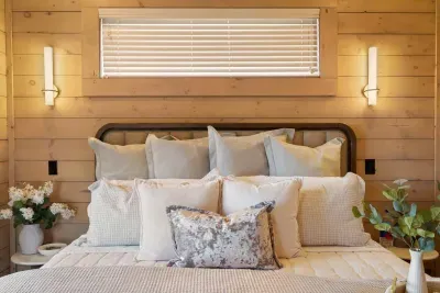 The master bedroom features a king-size bed with plush, hotel-quality bedding for ultimate comfort. It’s a cozy, luxurious space designed for restful nights and peaceful mornings.