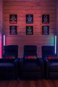 The game room has LED lights that shift colors and set a playful mood. Neon hues bounce off the walls, creating a fun, upbeat atmosphere that feels like your own private arcade.