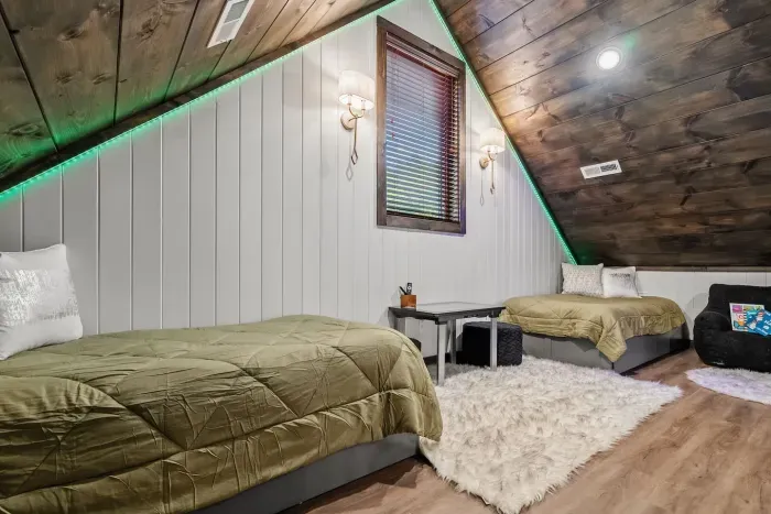 Upstairs loft comes with two twin beds that have tandem beds underneath. 