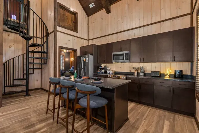 Open, modern, and full of character—this kitchen has it all.