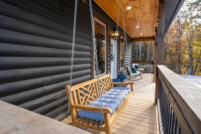 Relax on the porch swing with forest views
