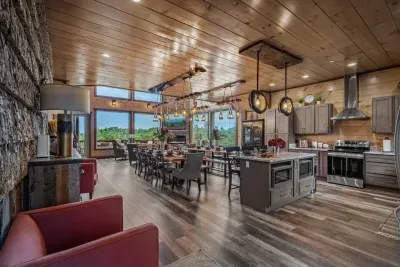 Straight ahead, the dining area anchors the space with a welcoming table that’s picture-perfect for family meals, game nights, or holiday celebrations.