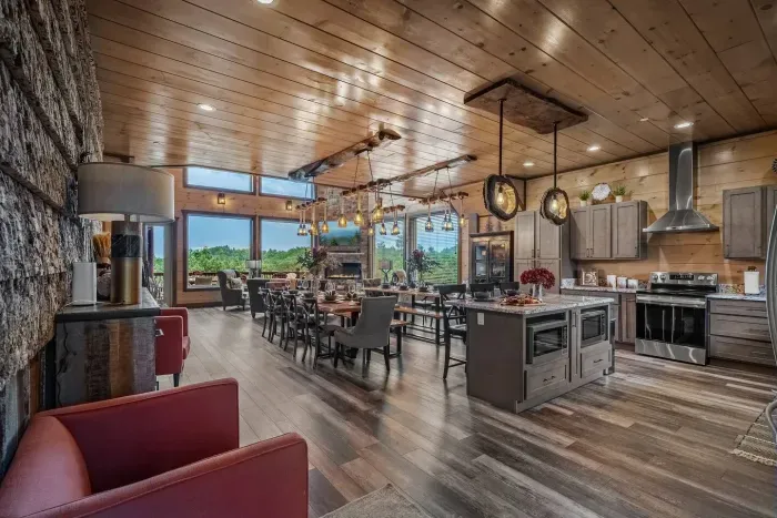 Straight ahead, the dining area anchors the space with a welcoming table that’s picture-perfect for family meals, game nights, or holiday celebrations.