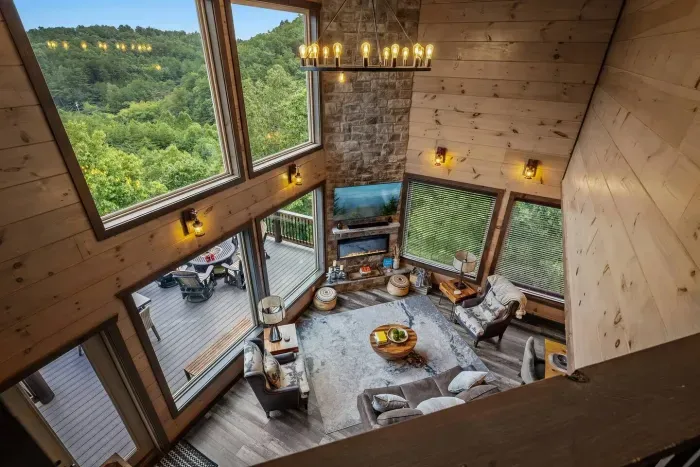 From upstairs, you get the perfect view looking down into the open, cozy living room—where the fireplace glows, the decor shines, and memories are made.