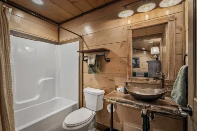 The fourth bedroom features its own private en suite bathroom, giving guests the perfect mix of comfort and privacy.