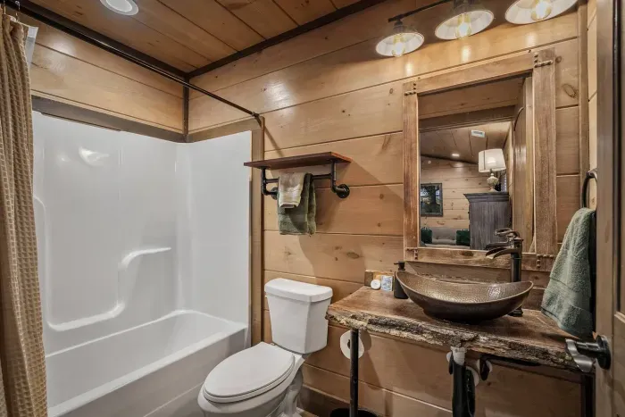 The fourth bedroom features its own private en suite bathroom, giving guests the perfect mix of comfort and privacy. 