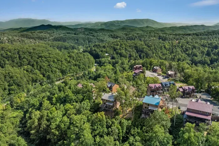 The cabin sits cradled by the Smokies, with luscious green rolling hills and the entire mountain range stretching around it. Everywhere you look, it’s endless views and pure mountain serenity.