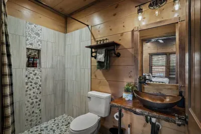 The second bathroom is stocked with face masks, makeup wipes, shower steamers, and a hairdryer—because every guest deserves a little luxury.