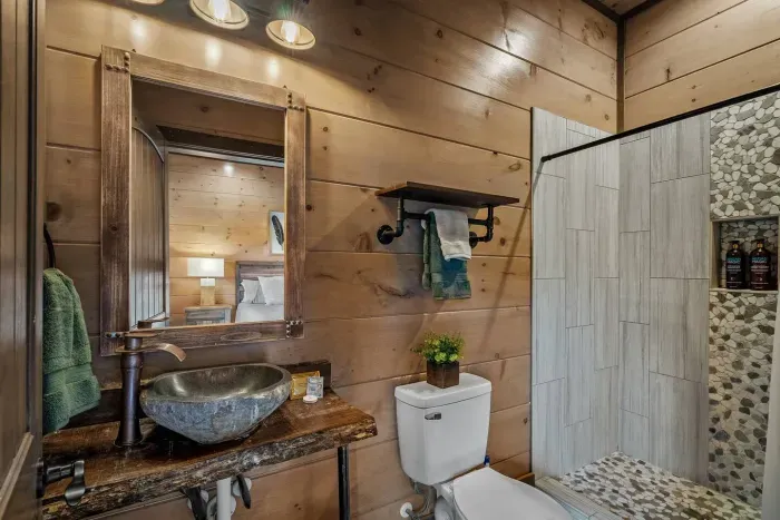 The master bathroom is stocked with all the little touches—face masks, makeup wipes, shower steamers, and a hairdryer—so you can relax and refresh in style. 