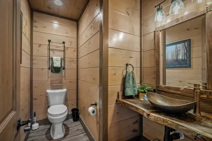 Conveniently located on the main level, the hallway half bath is perfect for guests and quick stops between adventures.