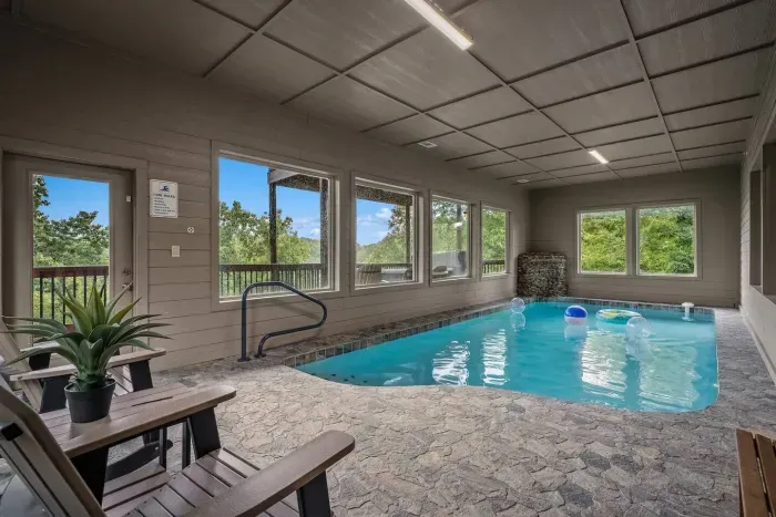 Dive into fun without leaving the cabin! Our indoor pool features glowing lights, calming water features, and two lounge chairs for when you’re ready to relax.