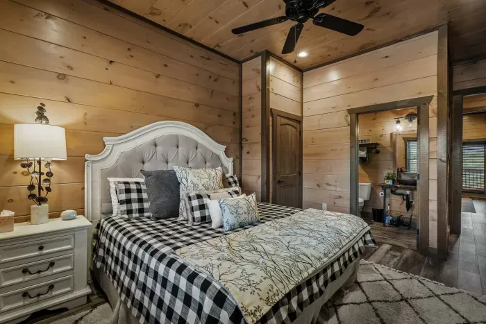 The second bedroom features a plush king bed, bedside table, and storage so you can fully unpack and unwind. Just like the master suite, it’s designed for comfort and style.
