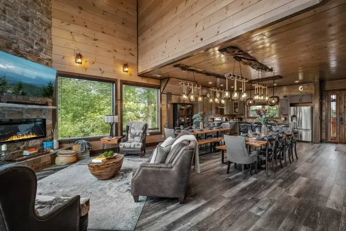 Cozy living room view : sofa + 2 large seats + dining tables that seats 20