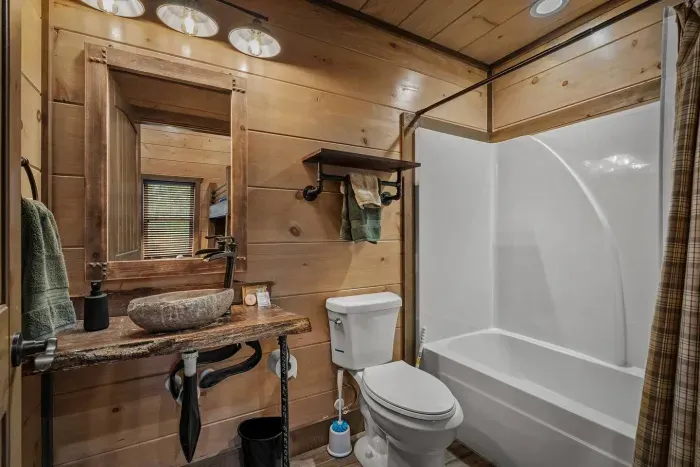 The bunk room comes with its own en suite bathroom, giving kids (or adults) their own private space to get ready. 