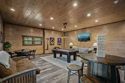 The game room downstairs is packed with fun—pool table, arcade games, Jenga, and even a poker table.