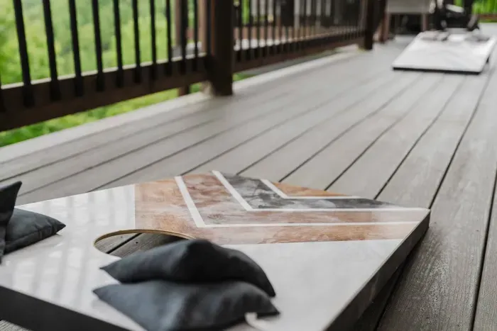 Head out to the upper balcony and challenge your crew to a game of cornhole.