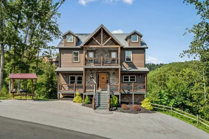 At the front of the cabin, you’ll find a grill off to the side for easy cookouts and outdoor trash cans for convenience.