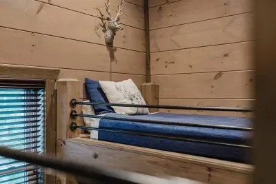 With two bunk beds, the navy bunk room is perfect for siblings, cousins, or friends—ideal for late-night laughs and morning adventures.