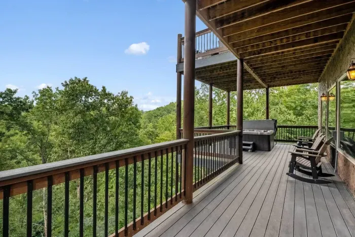 Step out from the pool room and onto your private balcony  With a bench, comfy seats, and a bubbling hot tub, it’s the perfect place to unwind after a swim and soak in the quiet Smoky Mountain air.