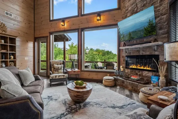 The living room is framed by mountain views, creating the perfect backdrop for unwinding at the end of the day. Whether you’re curled up with a good book, sipping a glass of wine, or simply soaking in the scenery, the view becomes the centerpiece
