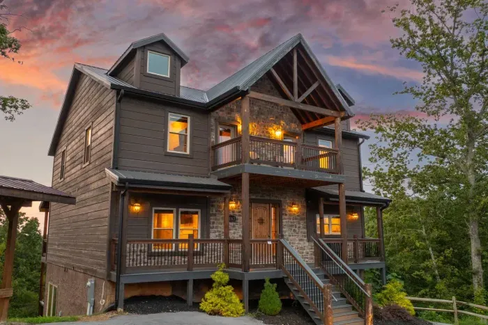 Against the backdrop of pink and blue skies, the scene feels equal parts luxury and mountain escape.