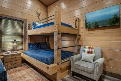 The bunk room is every kid’s dream—two navy bunk beds, plenty of space, and endless memories waiting to be made.