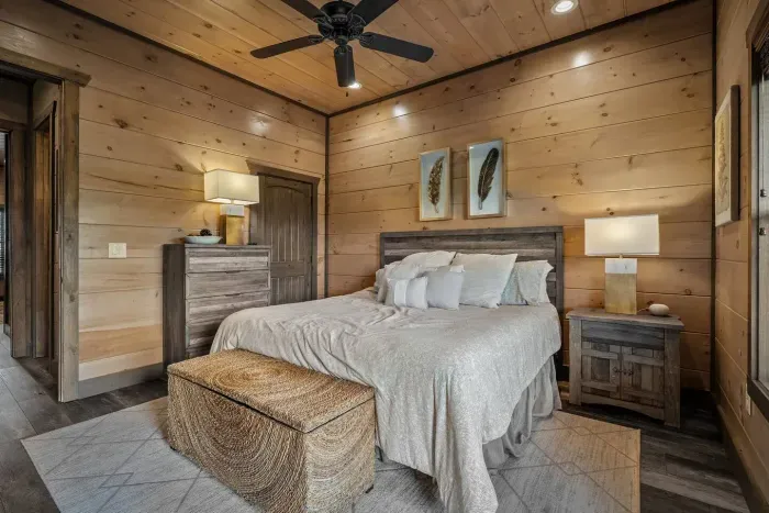 The master bedroom offers a spacious king bed, thoughtfully styled with plenty of storage for your stay. 