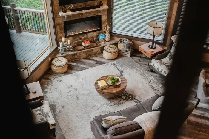 Overlooking the living room from above—you’ll see just how open, cozy, and connected this cabin feels. 