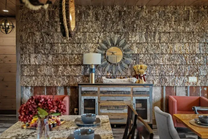 Special touch: One of the most unique features of the cabin is the accent wall crafted with real bark. 