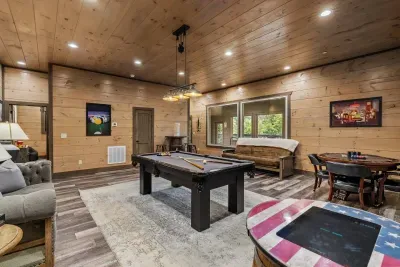 The downstairs game room features a full-size pool table where friendly competition meets mountain vibes. Line up your best shot, grab a drink, and let the good times roll.