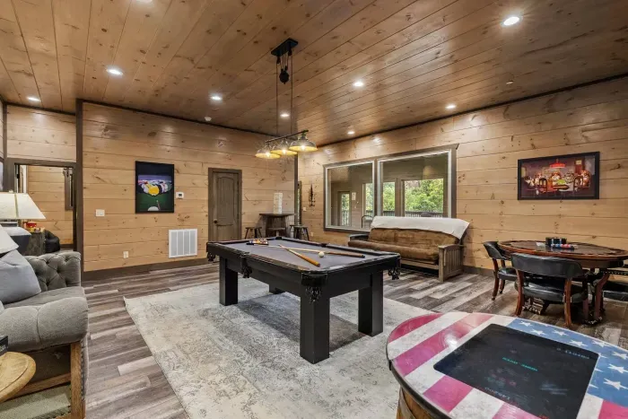 The downstairs game room features a full-size pool table where friendly competition meets mountain vibes. Line up your best shot, grab a drink, and let the good times roll.