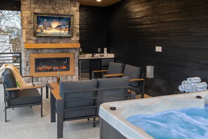 Hot tub relaxation paired with cozy seating and firelight