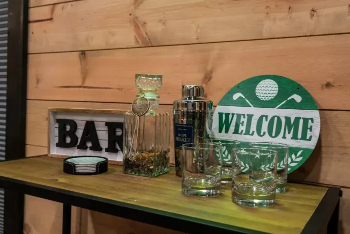 Game room bar area with glassware and cocktail essentials