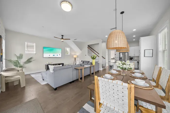 Living, dining, and kitchen all share one bright open level, so whoever's cooking is still part of the conversation.