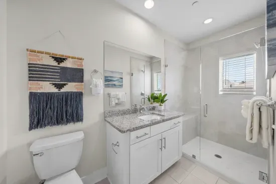 The king en-suite has a walk-in tile shower and a private vanity, so the primary guest never has to share.