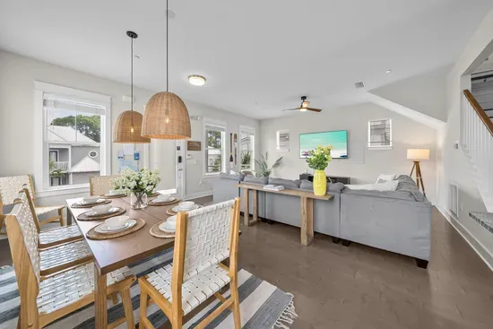 The dining table sits between the living room and the kitchen, which is exactly where everyone ends up anyway.