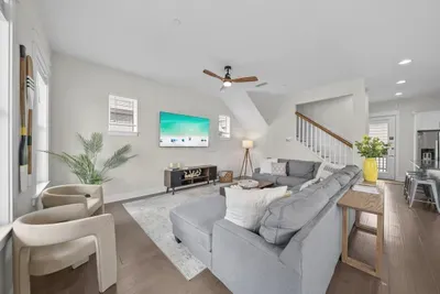 The main level opens up the moment you walk in. Sink into the U-shaped sectional with a movie on the 65-inch smart TV while dinner comes together a few steps away.