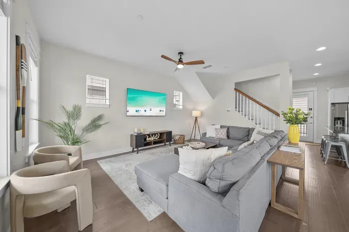 The main level opens up the moment you walk in. Sink into the U-shaped sectional with a movie on the 65-inch smart TV while dinner comes together a few steps away.