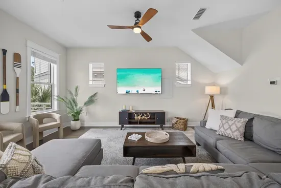 Beach days end here. Kick your feet up, put on something everyone agrees on, and let the 65-inch screen do the rest.
