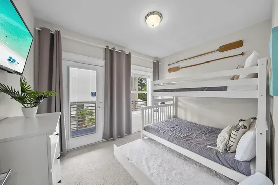 The bunk room is the one the kids call first: a pyramid bunk with a double on the bottom, a twin on top, its own TV, and a door to the balcony.