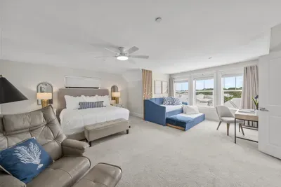 The entire third floor is yours: a king bed, a twin daybed by the windows, and enough room that nobody feels on top of anyone else.