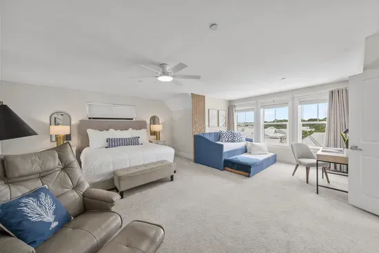 The entire third floor is yours: a king bed, a twin daybed by the windows, and enough room that nobody feels on top of anyone else.