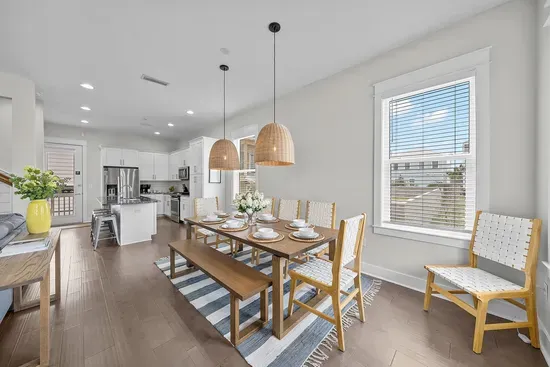 Seating for eight with the kitchen just behind, so serving a big meal never means crossing the house.