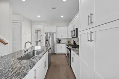 Deep counters, a full-size dishwasher, and storage to spare, so a week of real cooking never feels cramped.