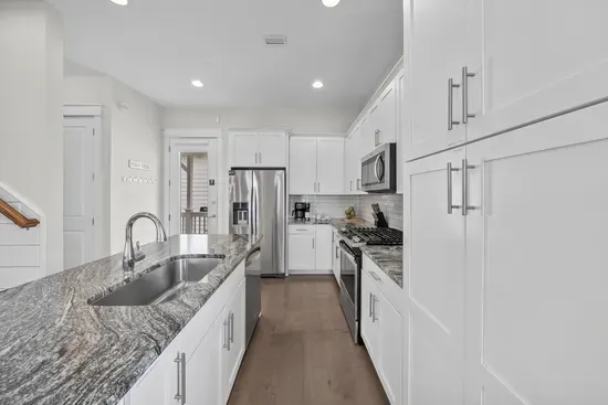 Deep counters, a full-size dishwasher, and storage to spare, so a week of real cooking never feels cramped.