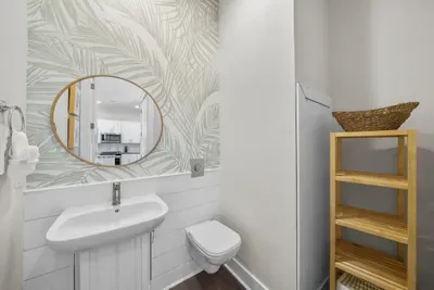 A half bath on the main level, right by the laundry, so nobody has to head upstairs mid-meal.