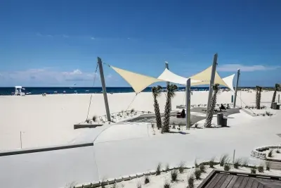 This stunning public beach access is just a 10-minute walk from the house — white sand, crystal water, and room to relax!